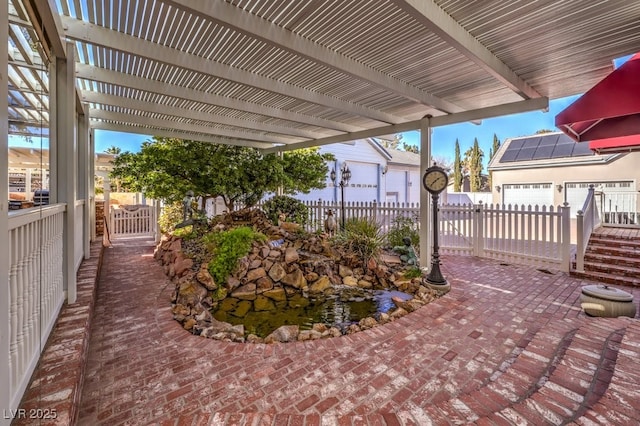 view of patio with a pergola and a garage