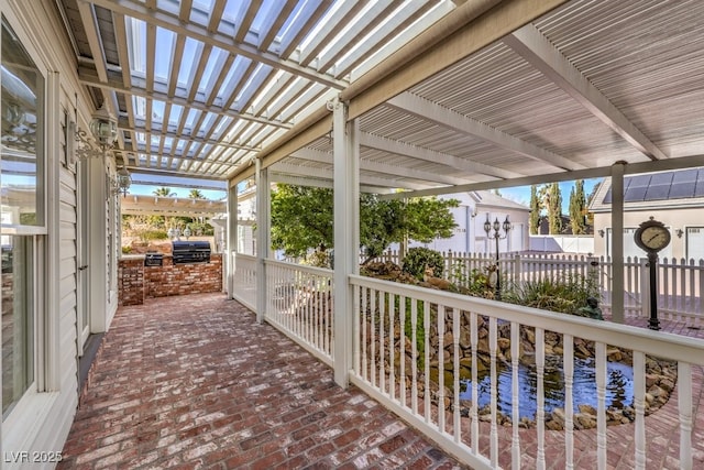 view of patio with a pergola, an outdoor kitchen, and area for grilling