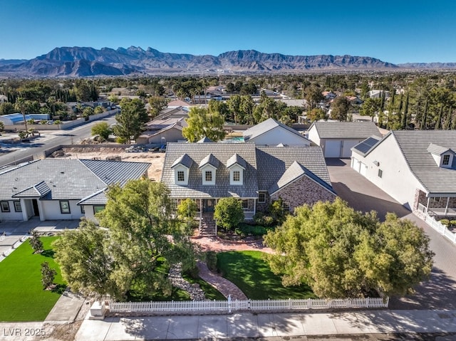 birds eye view of property featuring a mountain view