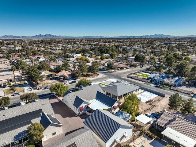 birds eye view of property with a mountain view