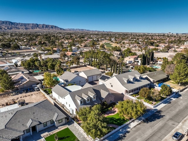 birds eye view of property with a mountain view