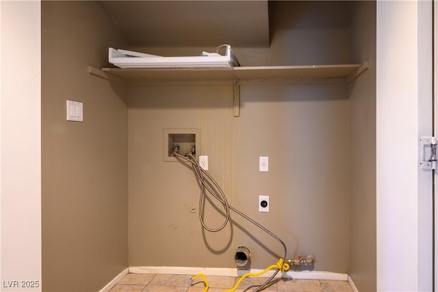 washroom featuring washer hookup, light tile patterned floors, and electric dryer hookup