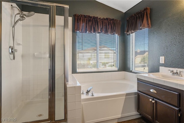 bathroom with vanity and independent shower and bath