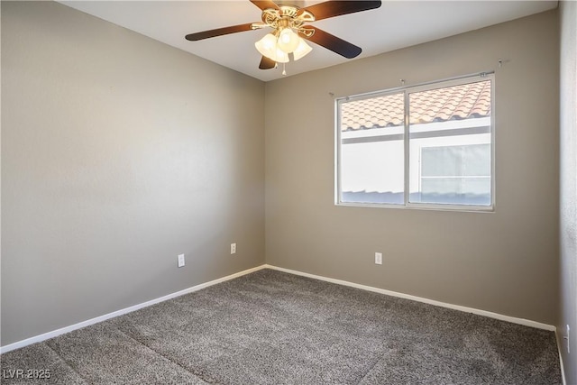 spare room with carpet floors and ceiling fan