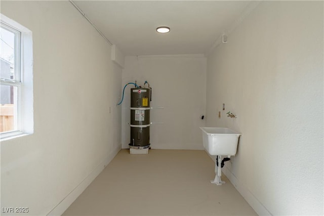 laundry room featuring secured water heater