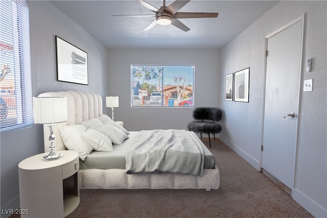 bedroom with ceiling fan and carpet flooring