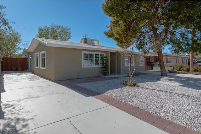 single story home with a patio area and central air condition unit