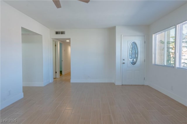 foyer with ceiling fan and light hardwood / wood-style flooring