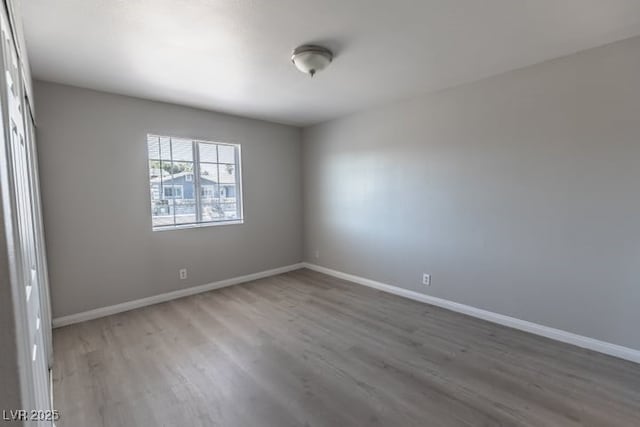 spare room featuring hardwood / wood-style flooring