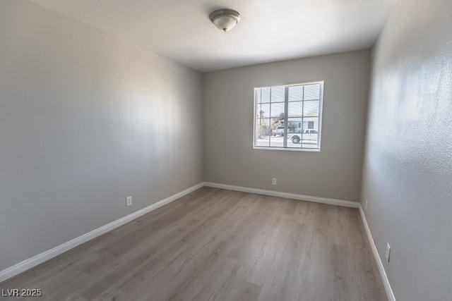 unfurnished room with light hardwood / wood-style flooring