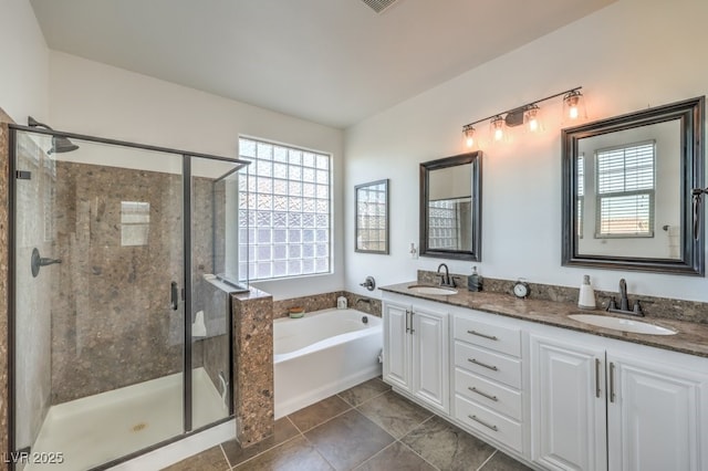 bathroom featuring vanity and shower with separate bathtub