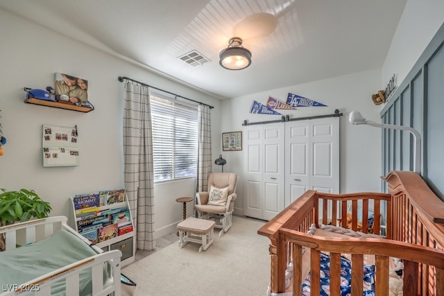 carpeted bedroom with a closet