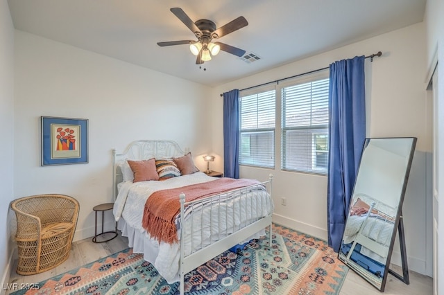 bedroom featuring ceiling fan and light wood-type flooring