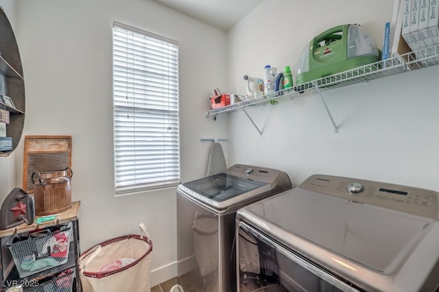 clothes washing area featuring washing machine and clothes dryer