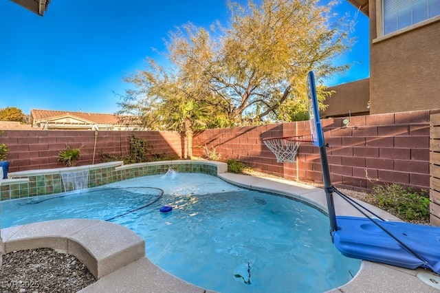 view of swimming pool featuring pool water feature