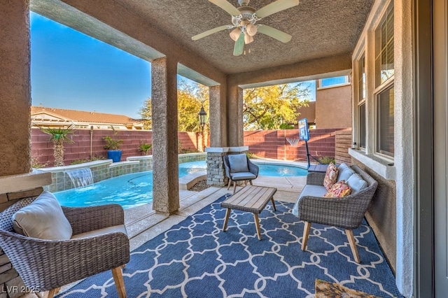 sunroom featuring ceiling fan