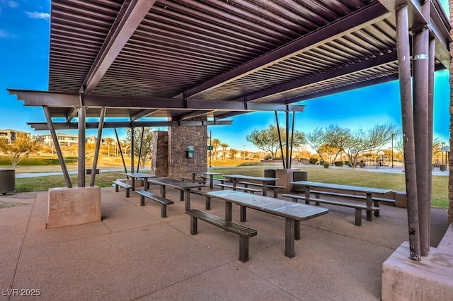 view of property's community with a pergola and a patio area