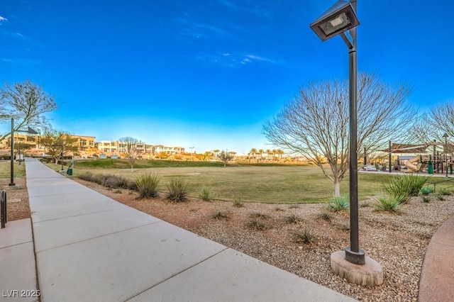 view of community featuring a lawn and a playground