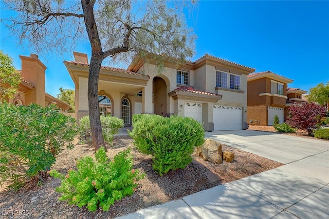 mediterranean / spanish-style house featuring a garage