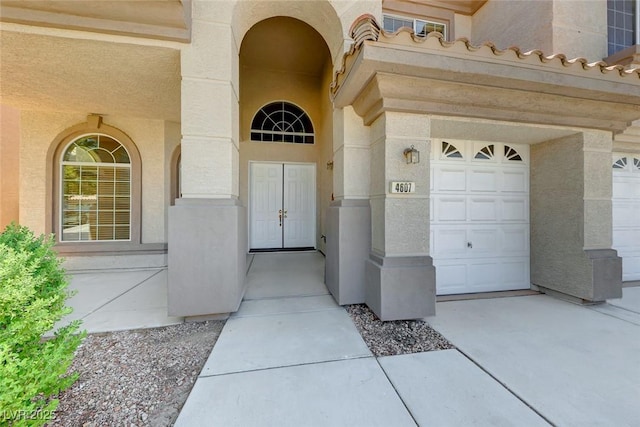 entrance to property featuring a garage