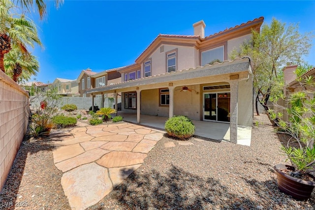 back of house featuring ceiling fan and a patio