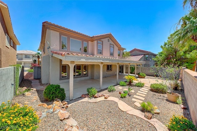 back of property with a patio area