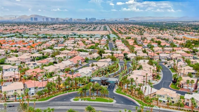 birds eye view of property with a mountain view