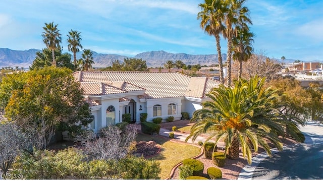 mediterranean / spanish house featuring a mountain view