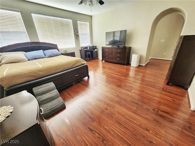 bedroom featuring ceiling fan and hardwood / wood-style flooring