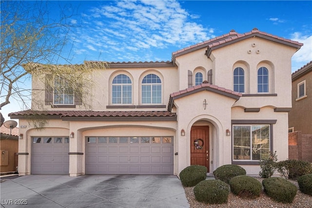 mediterranean / spanish-style home featuring a garage