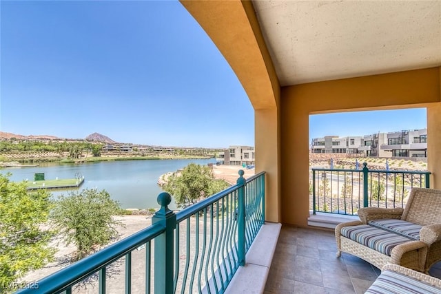 balcony featuring a water view