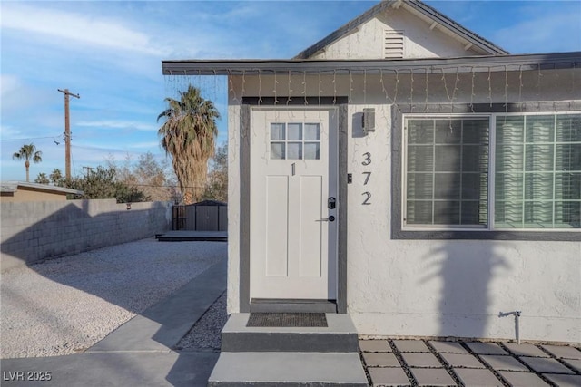 entrance to property featuring a patio