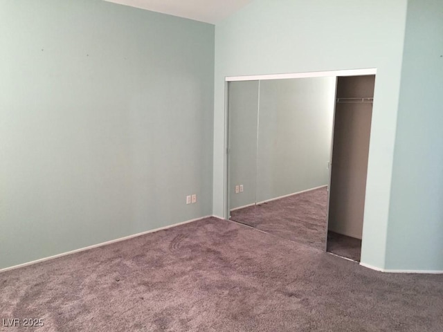 unfurnished bedroom featuring a closet and carpet flooring