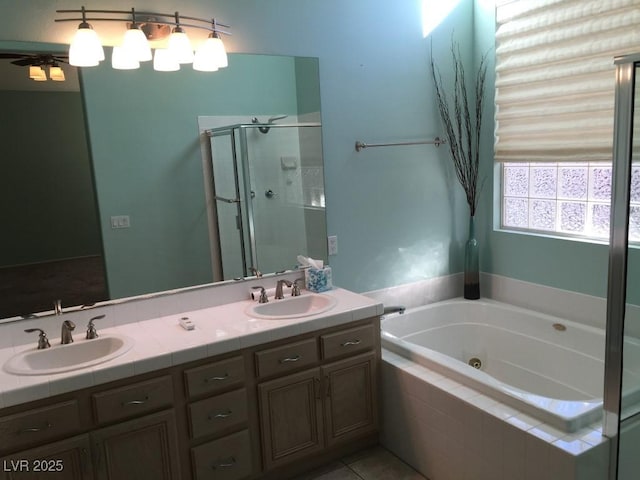 bathroom featuring vanity, separate shower and tub, and tile patterned flooring