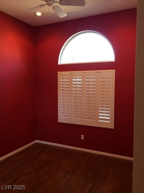 unfurnished room featuring ceiling fan and hardwood / wood-style floors