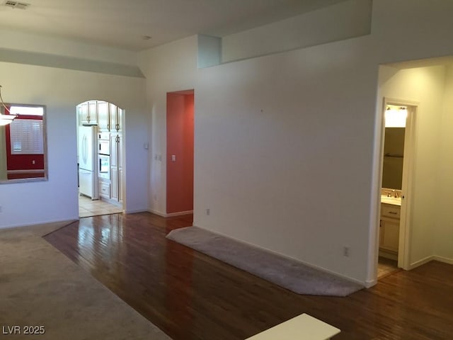 spare room with hardwood / wood-style flooring