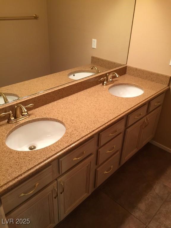 bathroom featuring tile patterned flooring and vanity