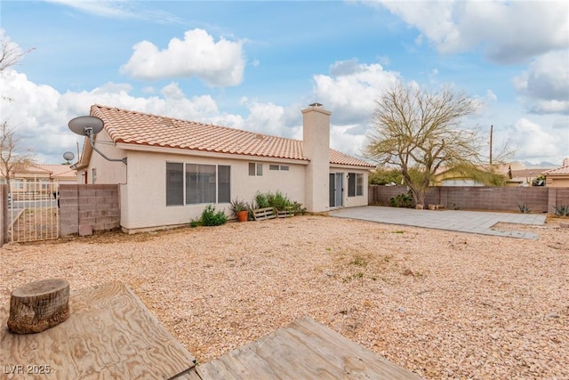 rear view of house with a patio