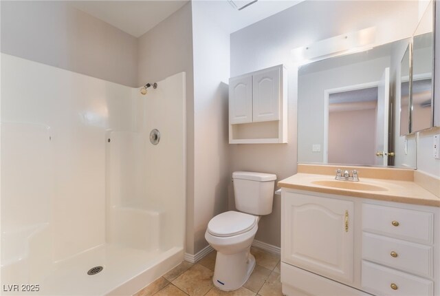 bathroom with toilet, walk in shower, vanity, and tile patterned flooring