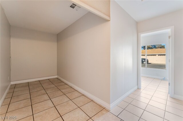 corridor featuring light tile patterned floors