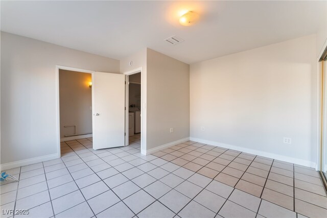 spare room with light tile patterned floors