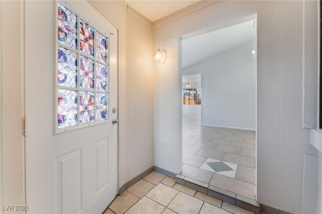 doorway featuring light tile patterned floors and a healthy amount of sunlight