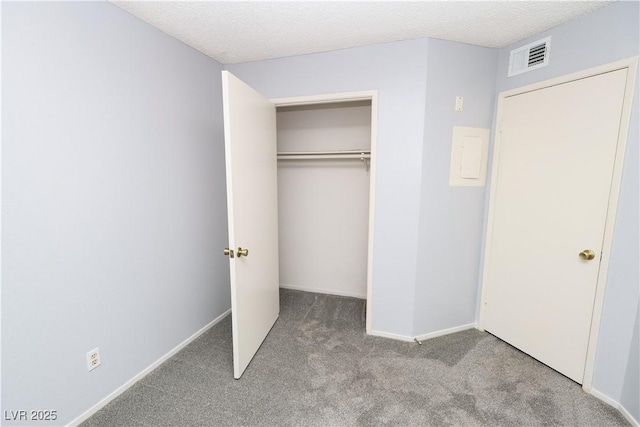 3790 Desert Marina Dr Unit 147, Laughlin, NV 89029 - unfurnished bedroom featuring carpet, a closet, baseboards, and a textured ceiling