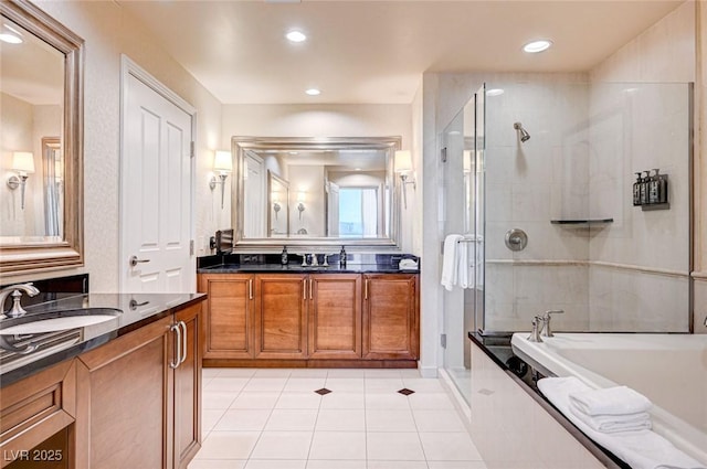 bathroom featuring separate shower and tub, vanity, and tile patterned flooring