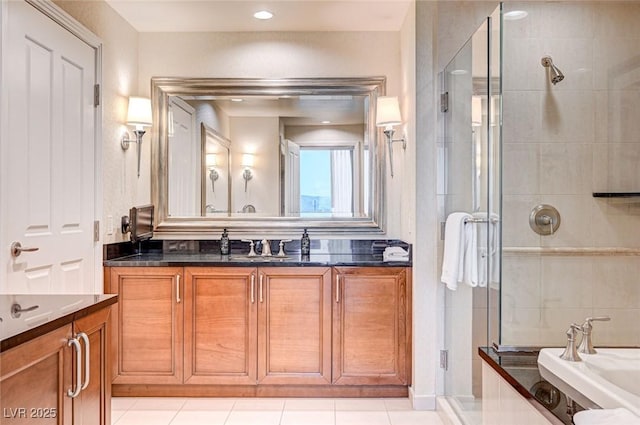 bathroom with tile patterned flooring, separate shower and tub, and vanity