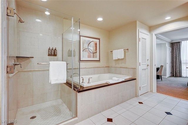 bathroom featuring tile patterned floors and independent shower and bath