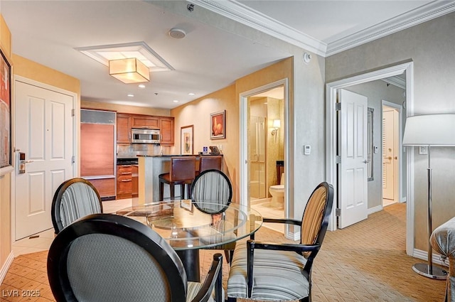 dining area with ornamental molding