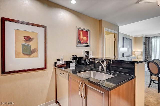 kitchen featuring dishwasher, dark stone countertops, sink, ornamental molding, and kitchen peninsula