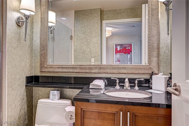 bathroom featuring toilet and vanity