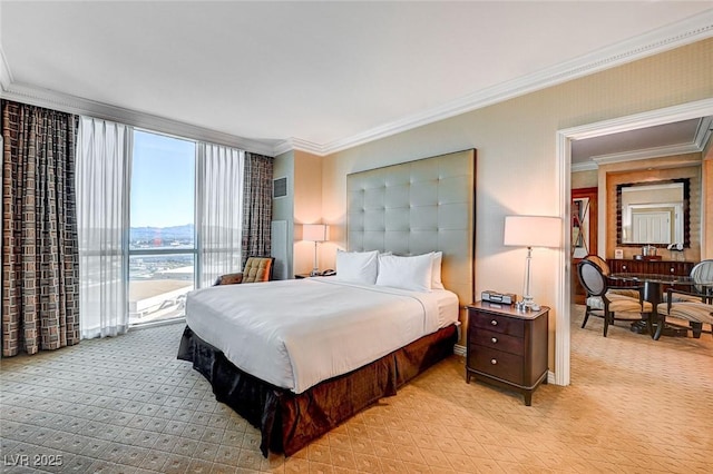 bedroom with floor to ceiling windows, access to exterior, and ornamental molding